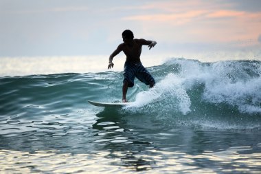 Surfer in ocean clipart