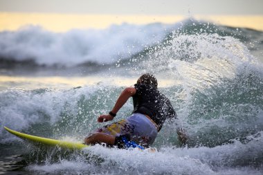 Surfer in ocean clipart