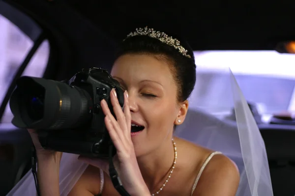 Bride with the camera — Stock Photo, Image