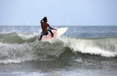 Surfer in ocean clipart