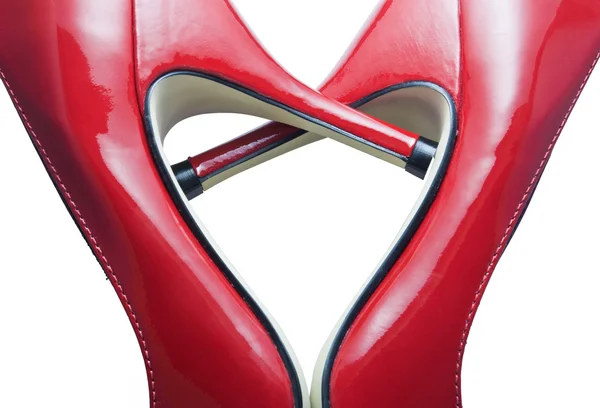 Détail de chaussures rouges formant un cœur — Photo