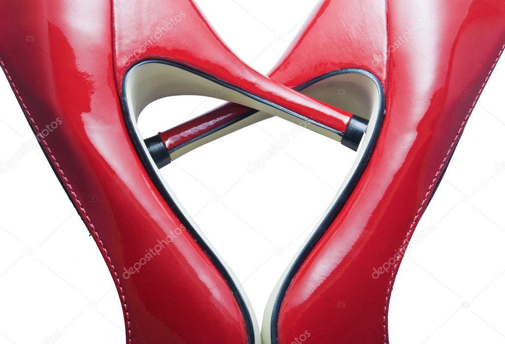 Detail of red shoes forming a heart