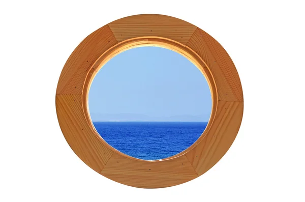 Круглое окно с видом на море — стоковое фото