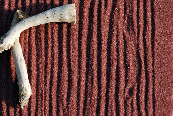 Background of red sand with sticks