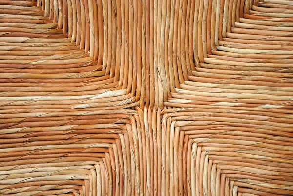 Wicker chair, straw background — Stock Photo, Image