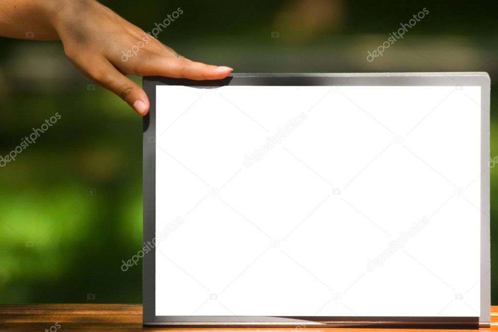 The white sheet of paper on the clipboard and the hand