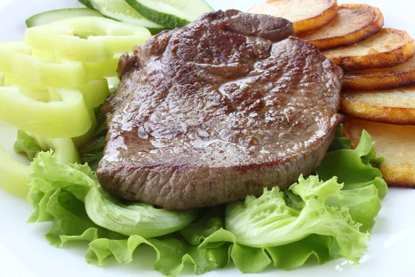 Carne asada con verduras Fotos De Stock