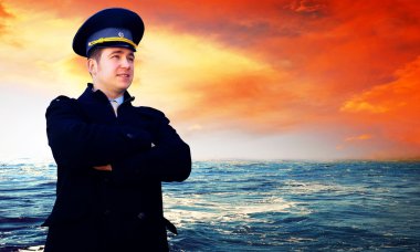 Capitan on the sea with ship clipart