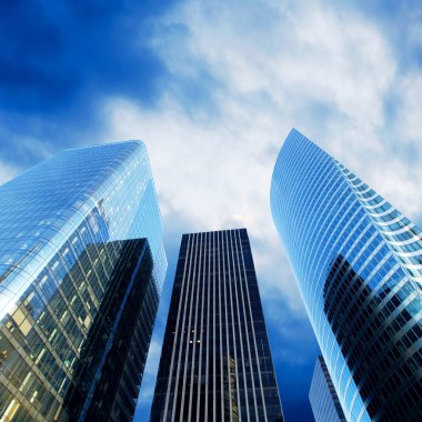 Modern office Skyscrapers on the sunny beautiful sky clipart