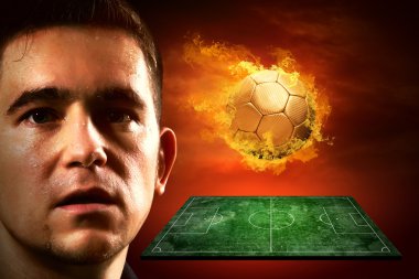 sahada futbol oyuncu ve ateş topu