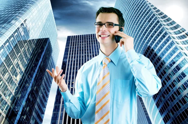 Hapiness Businessman standing on the business background — Stock Photo, Image