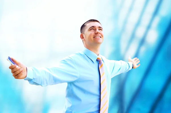 Hapiness Businessman standing on the business background — Stock Photo, Image