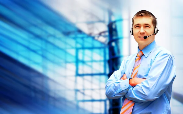 Happiness businessman in headphoness on the business architectur — Stock Photo, Image