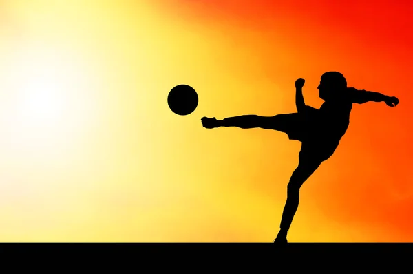 stock image Silhouettes of footballers on the sunset sky