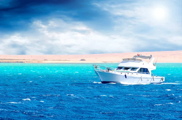 stock image Side view of motor yacht under way out at sea