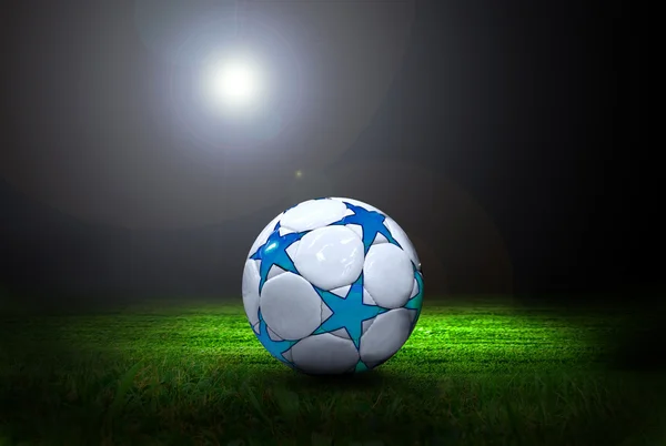 Bola de futebol no campo de estádio com luz — Fotografia de Stock