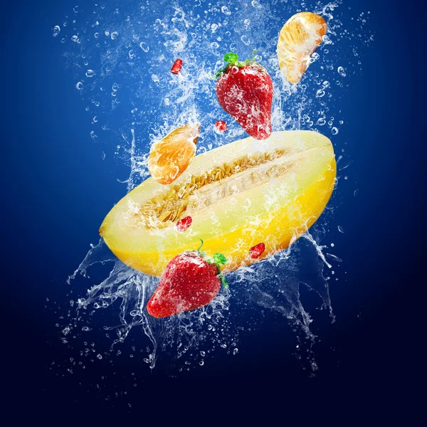 Water drops around fruits on blue background — Stock Photo, Image