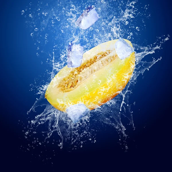 Stock image Water drops around yellow melon on the ice