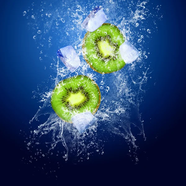 Water drops around kiwi and ice on blue background — Stock Photo, Image