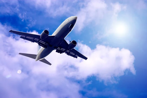Airplane on blue sky — Stock Photo, Image