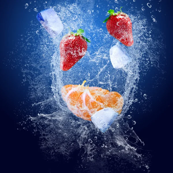 Water drops around fruits on blue background — Stock Photo, Image