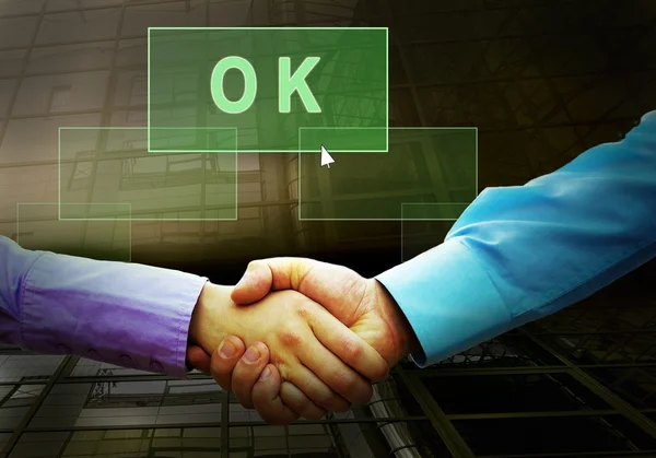 2 つの businessmans と光ボタン上のテキストの握手 — ストック写真