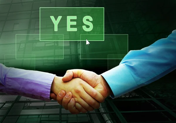 Handshake of two businessmans and text on the light button — Stok fotoğraf