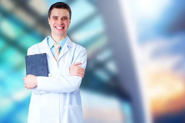 Χαμογελώντας γιατρός με το στηθοσκόπιο για τα νοσοκομεία backgro — Φωτογραφία Αρχείου