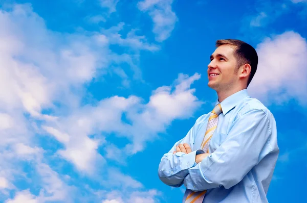 Happy businessmen on sky with clouds background — Stock Photo, Image