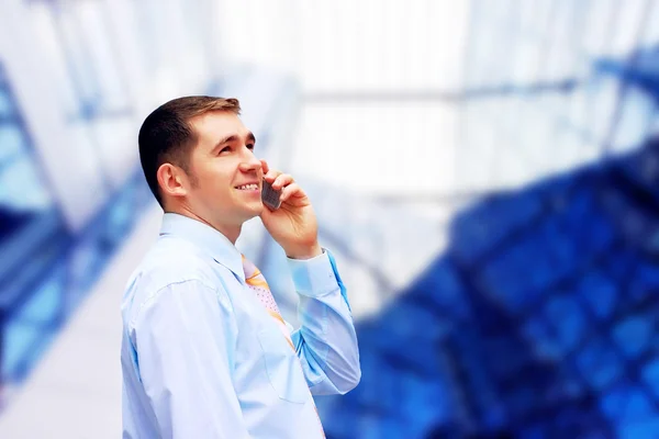 Happy businessman on the business architecture background — Stock Photo, Image