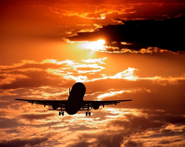 Samolot na niebo zachód słońca — Zdjęcie stockowe