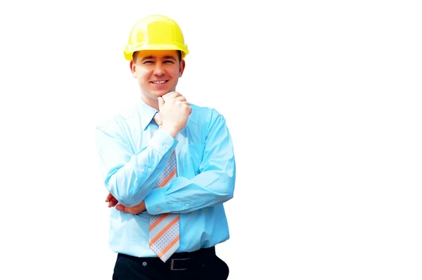 Mladý architekt, nosit ochrannou helmu stojící na budovy — Stock fotografie