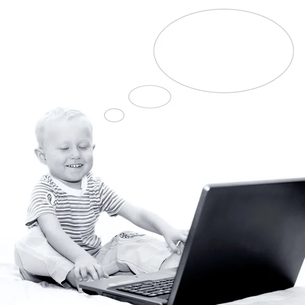 stock image Happiness boy has a good idea with laptop