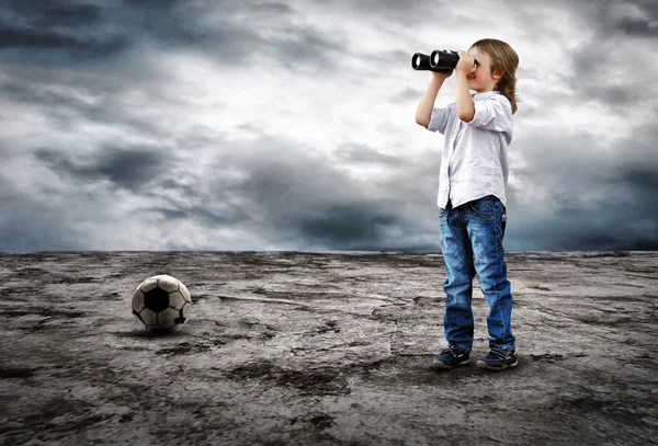 Young boy watch in the field-glass under sky — Stock Photo, Image