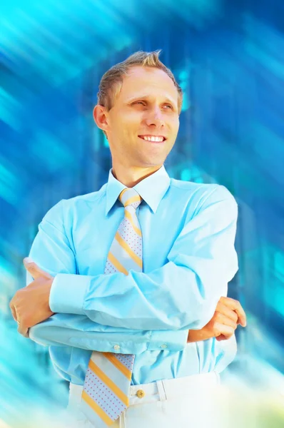 Happiness businessman on blur business architecture background — Stock Photo, Image