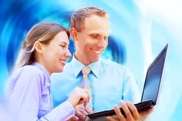 Happiness businessmans withlaptop on blur business architecture — Stock Photo, Image