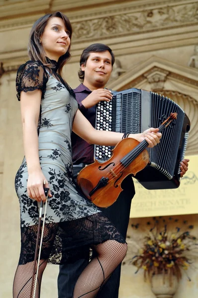Two musicants with instruments — Stock Photo, Image