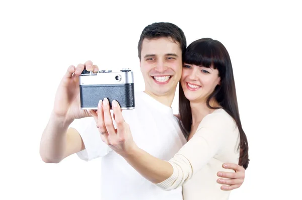Mladá kráska pár s fotoaparátem izolovaných na bílém poz — Stock fotografie