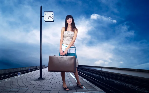 stock image Girl waiting train on the platform of railway station