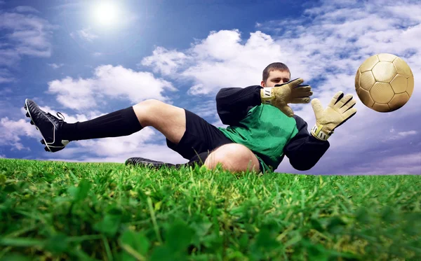 Jump of football goalman on the outdoor field — Stock Photo, Image
