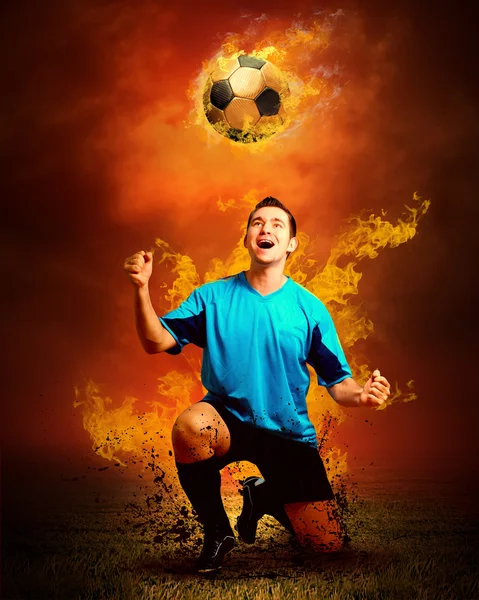 Football player in fires flame on the outdoors field — Stock Photo, Image