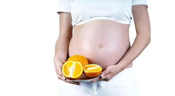 Felicità donne incinte nel bianco con arancione — Foto Stock