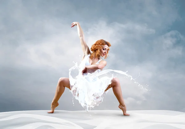 Jump of ballerina with dress of milk — Stock Photo, Image