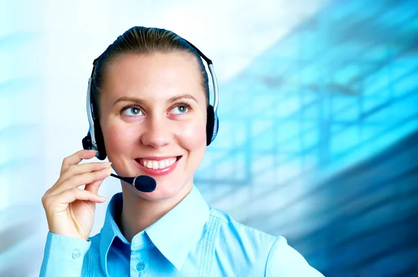 Felicidad mujer de negocios hablar en auriculares en el arco de negocios borrosa Imagen De Stock
