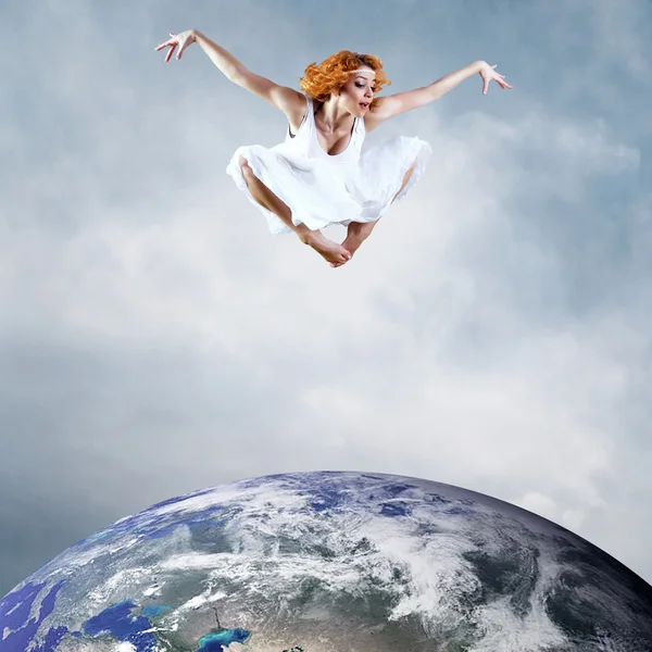 Jump of ballerina with dress of milk Royalty Free Stock Images