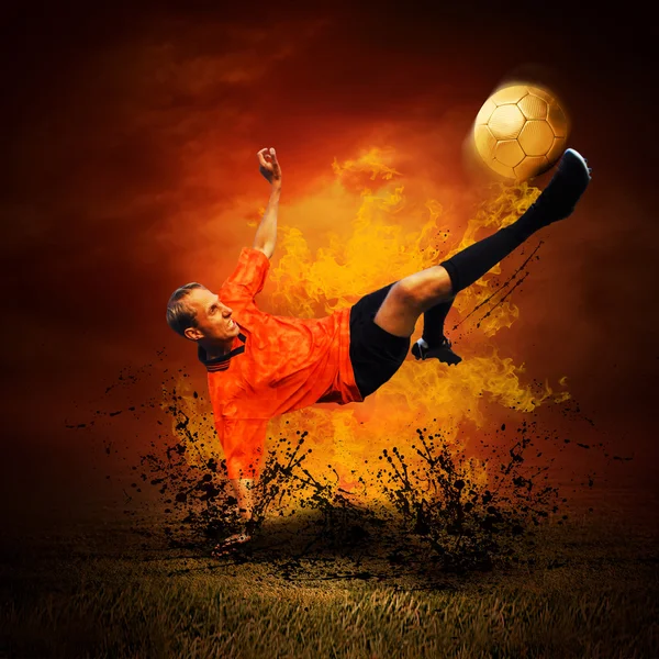 Football player in fires flame on the outdoors field Royalty Free Stock Images