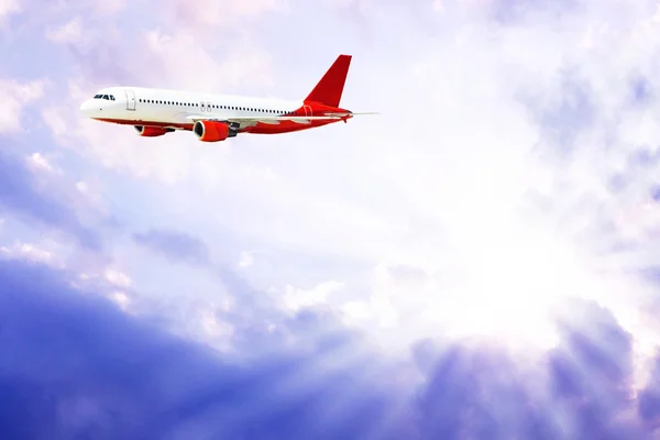 Airplane on the blue sky Royalty Free Stock Photos