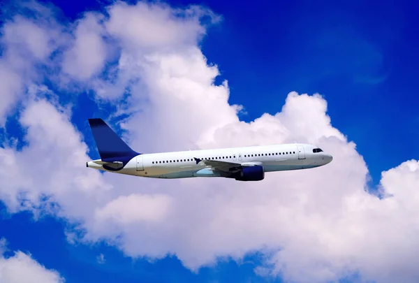 Airplane on blue sky Royalty Free Stock Images