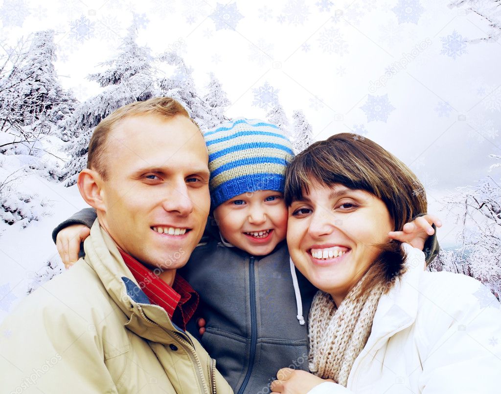 Happy family portrait outdoors smiling. Winter