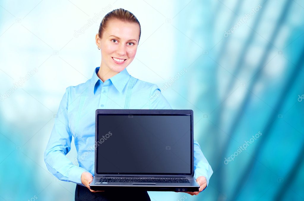 Happiness businesswoman with laptop on blur business architectur